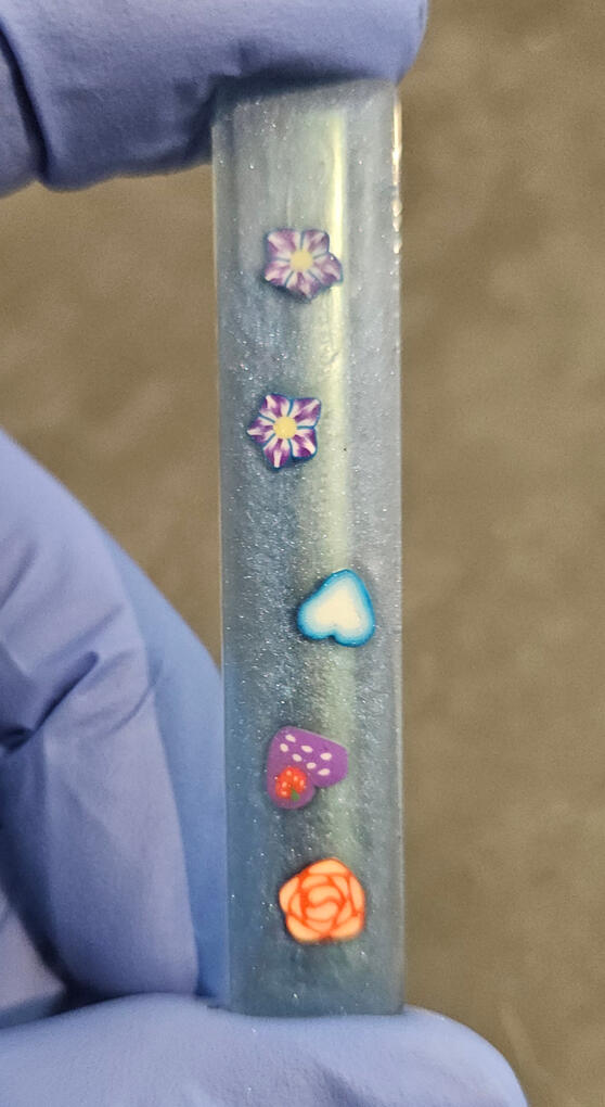 Blue skinny rectangle hair clip with flowers and hearts